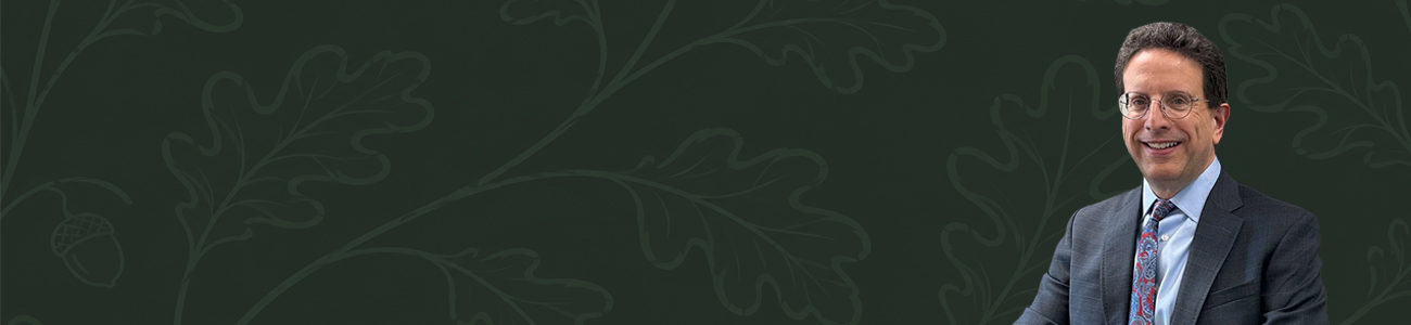 Michael I. Sherman against a dark green background with an oak leaf and acorn pattern.